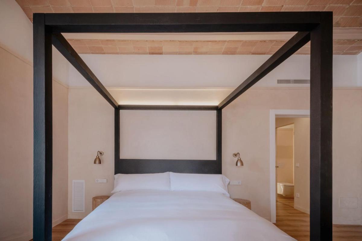 Cama o camas de una habitación en Hotel Palau Macelli & Spa