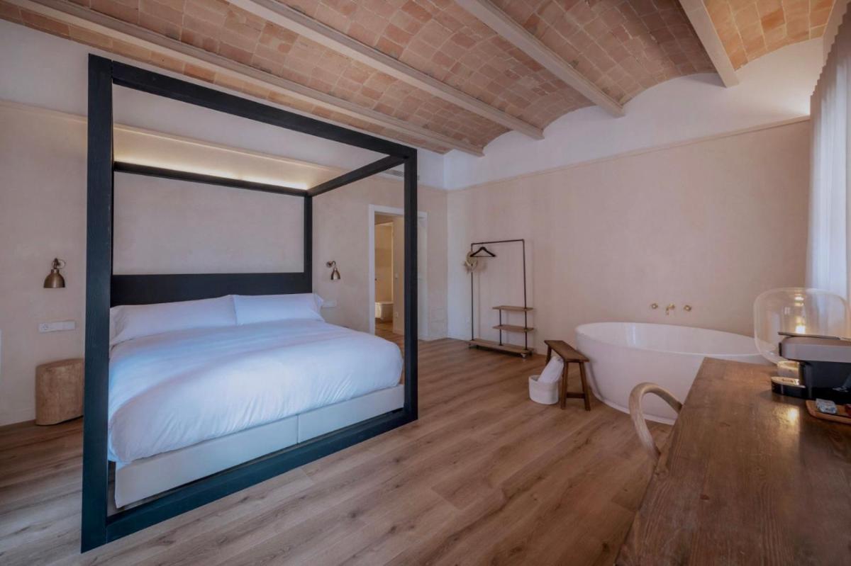 Cama o camas de una habitación en Hotel Palau Macelli & Spa