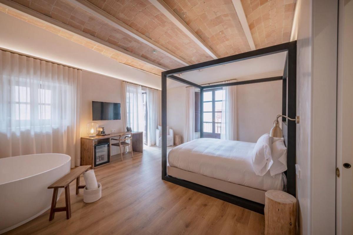 Cama o camas de una habitación en Hotel Palau Macelli & Spa