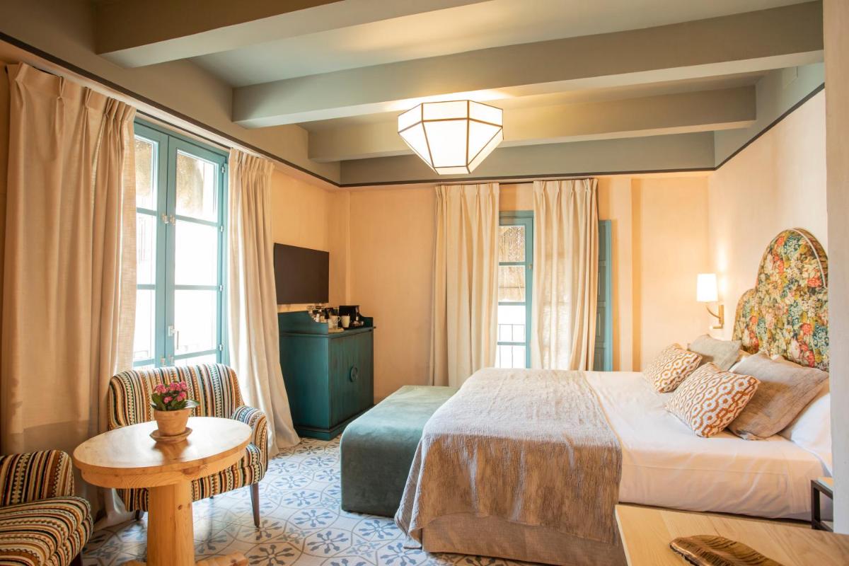 Cama o camas de una habitación en Hospes Las Casas del Rey de Baeza, a Member of Design Hotels