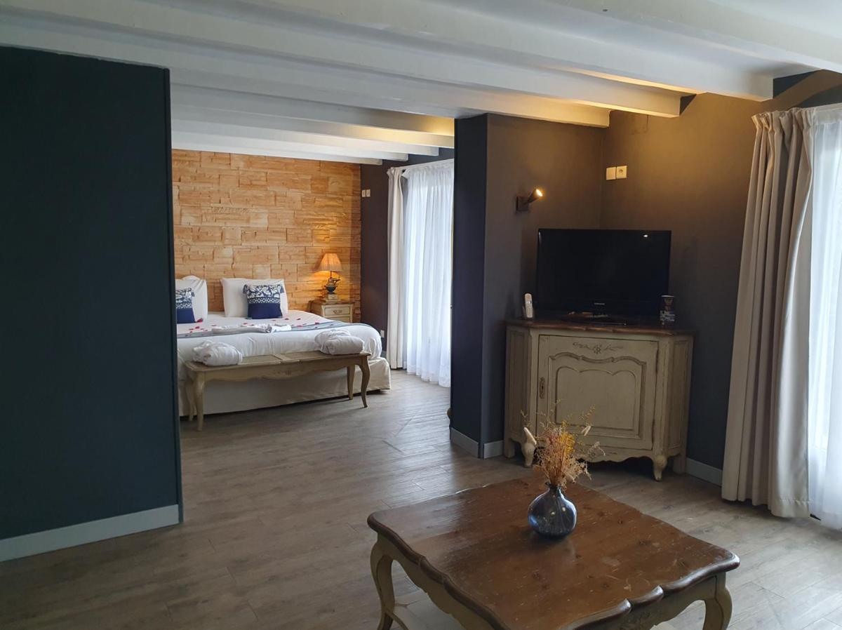 Un ou plusieurs lits dans un hébergement de l'établissement Le Belvédère Hotel et Bien être