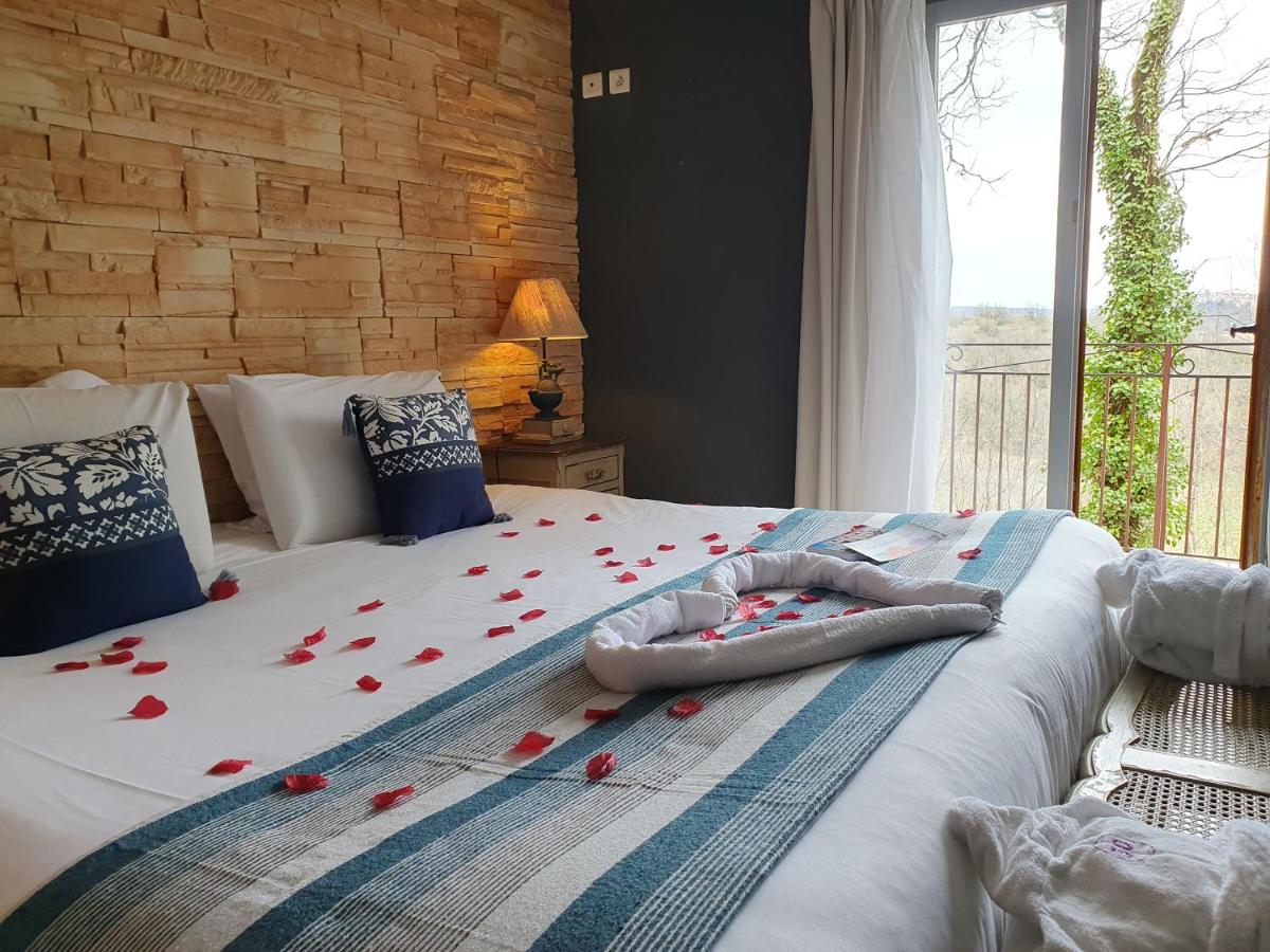 Un ou plusieurs lits dans un hébergement de l'établissement Le Belvédère Hotel et Bien être