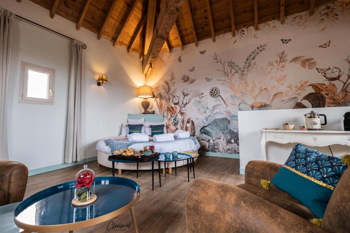Coin salon dans l'établissement Le Belvédère Hotel et Bien être