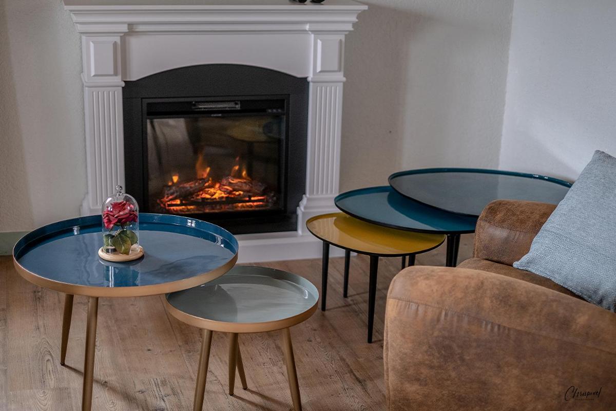 Coin salon dans l'établissement Le Belvédère Hotel et Bien être