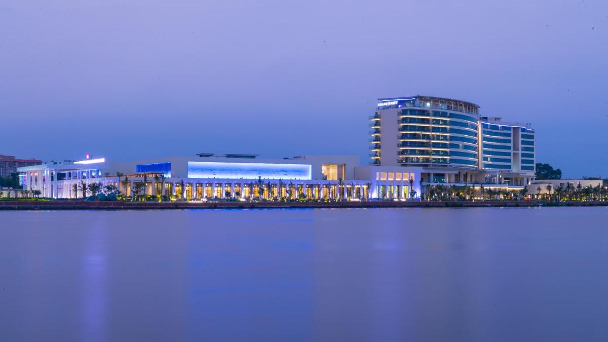 a view of a city with a large building at Grand Hyatt Kochi Bolgatty in Cochin