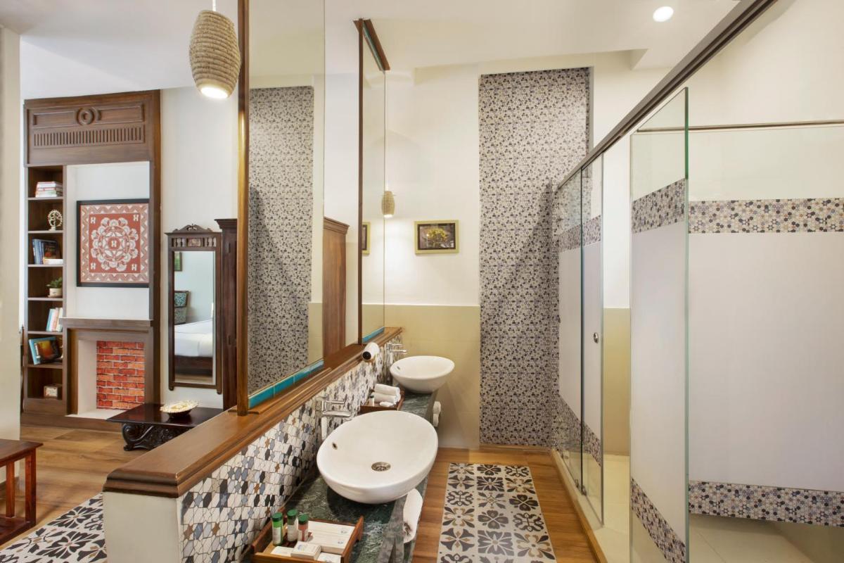 a bathroom with a sink and a mirror at Raga on the Ganges, Rishikesh in Rishīkesh