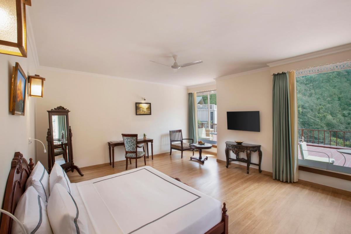 a living room with a ping pong table at Raga on the Ganges, Rishikesh in Rishīkesh