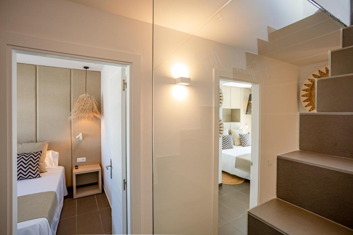 Cama o camas de una habitación en Migjorn Ibiza Suites & Spa
