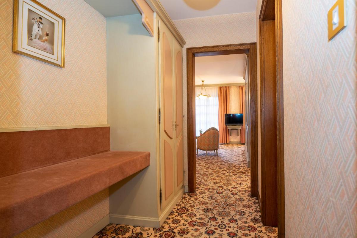 Un ou plusieurs lits dans un hébergement de l'établissement Hotel Munsch Restaurant & Wellness, Colmar Nord - Haut-Koenigsbourg
