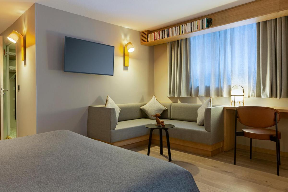Télévision ou salle de divertissement dans l'établissement Heliopic Hotel & Spa