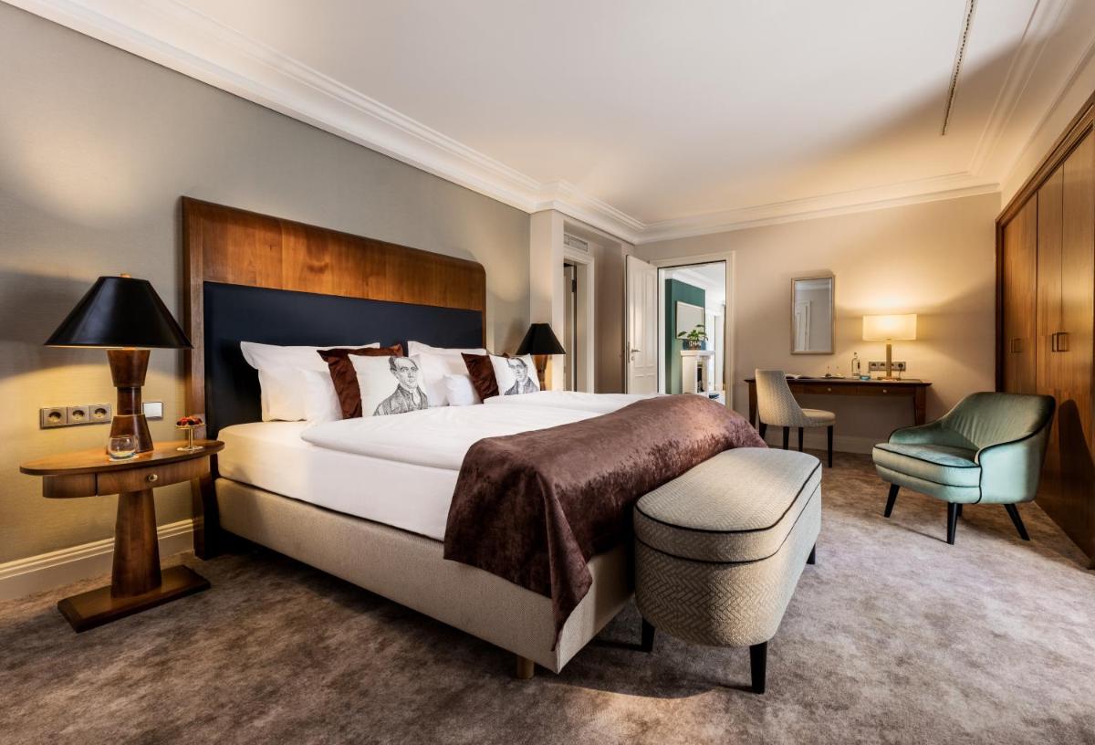 Ein Bett oder Betten in einem Zimmer der Unterkunft Maison Messmer - ein Mitglied der Hommage Luxury Hotels Collection