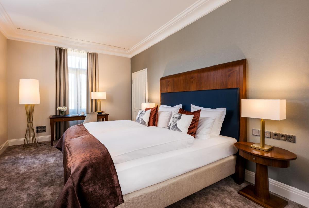 Ein Bett oder Betten in einem Zimmer der Unterkunft Maison Messmer - ein Mitglied der Hommage Luxury Hotels Collection