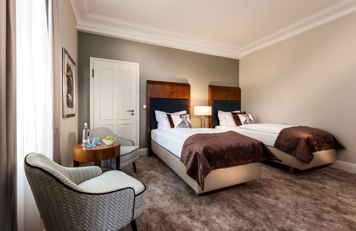 Ein Bett oder Betten in einem Zimmer der Unterkunft Maison Messmer - ein Mitglied der Hommage Luxury Hotels Collection