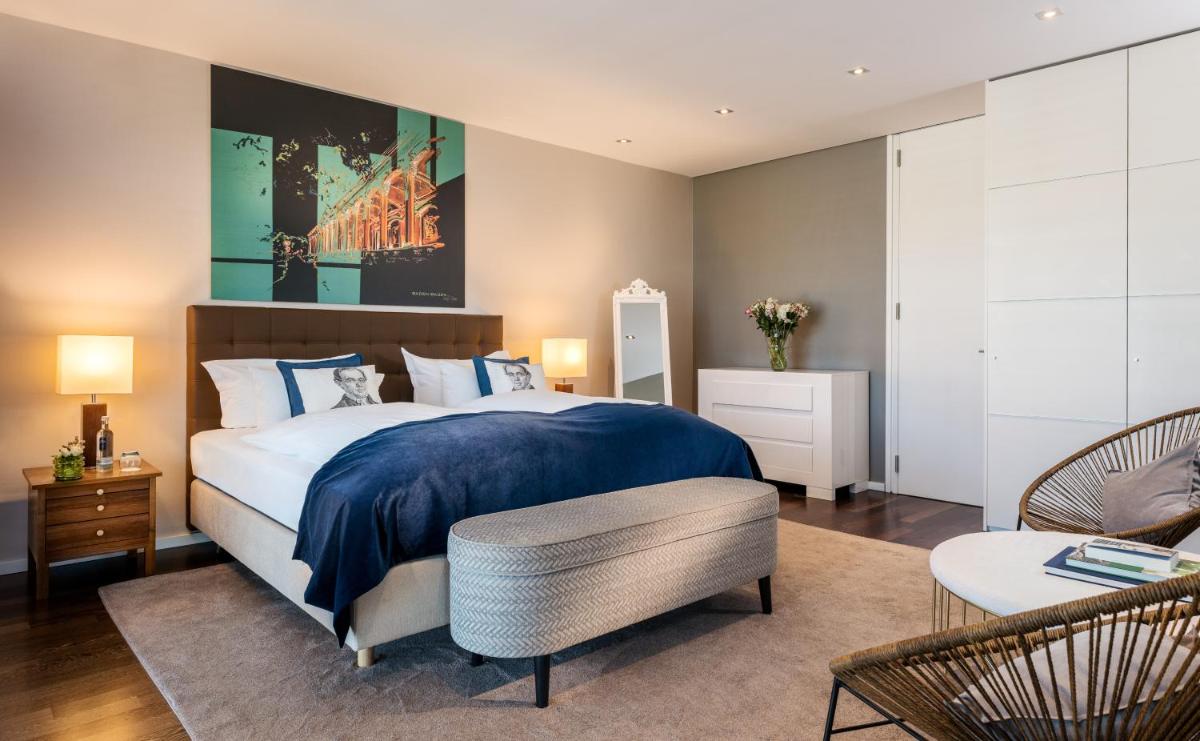 Ein Bett oder Betten in einem Zimmer der Unterkunft Maison Messmer - ein Mitglied der Hommage Luxury Hotels Collection