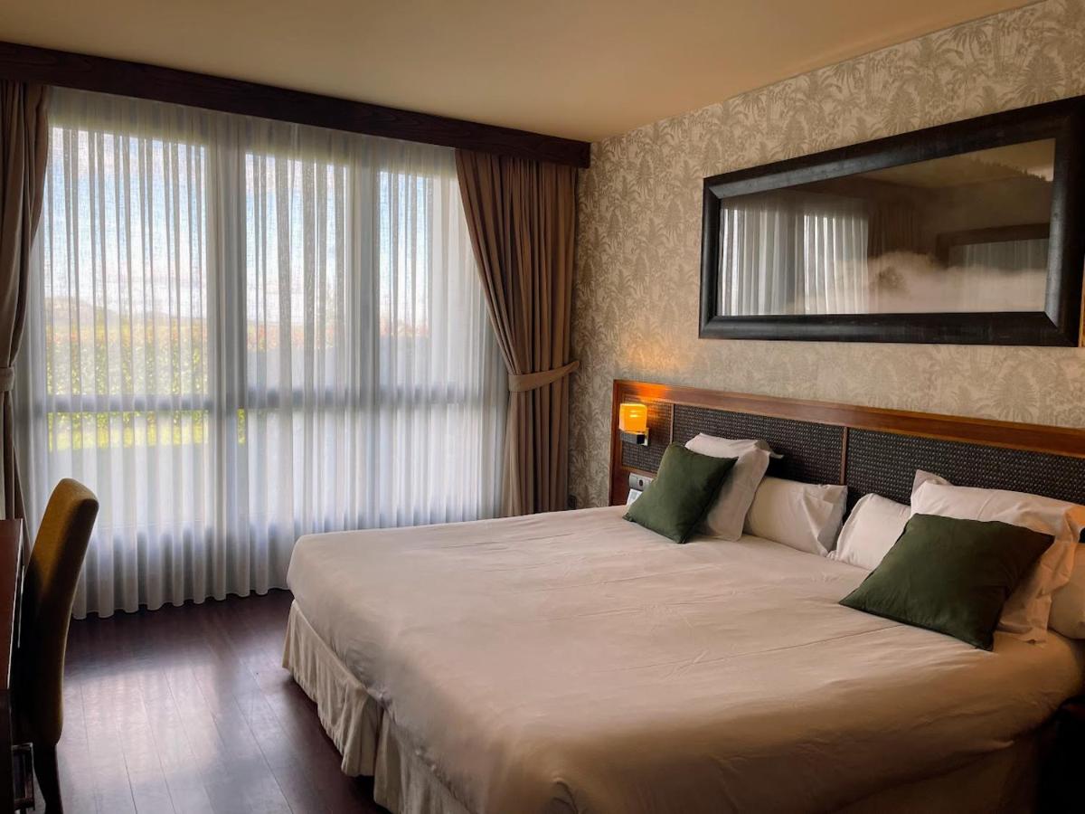 Cama o camas de una habitación en Hosteria de Torazo Nature Hotel & Spa