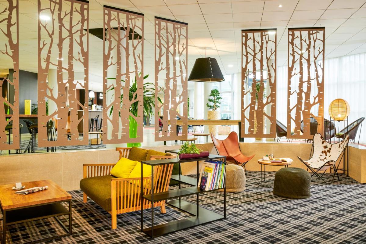 Coin salon dans l'établissement Novotel Senart Golf De Greenparc
