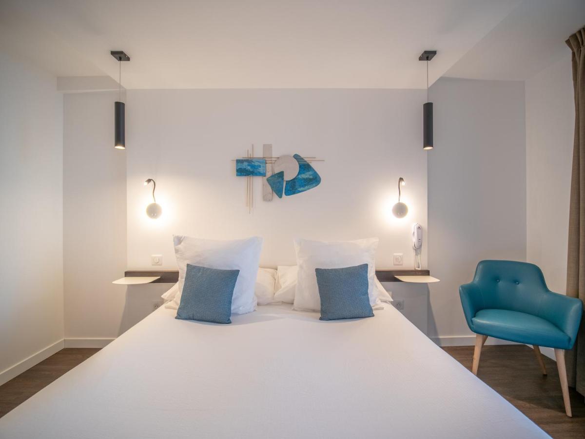 Un ou plusieurs lits dans un hébergement de l'établissement Côté Thalasso Hôtel & Spa Marin