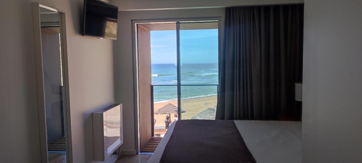 Uma cama ou camas num quarto em Promar - Eco Beach & Spa Hotel