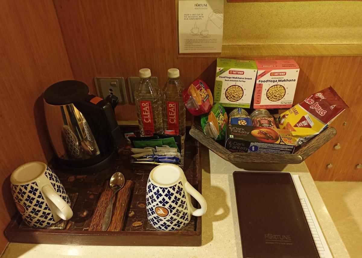 a counter top with cups and other items on it at Fortune Select SG Highway, Ahmedabad - Member ITC Hotels' Group in Ahmedabad