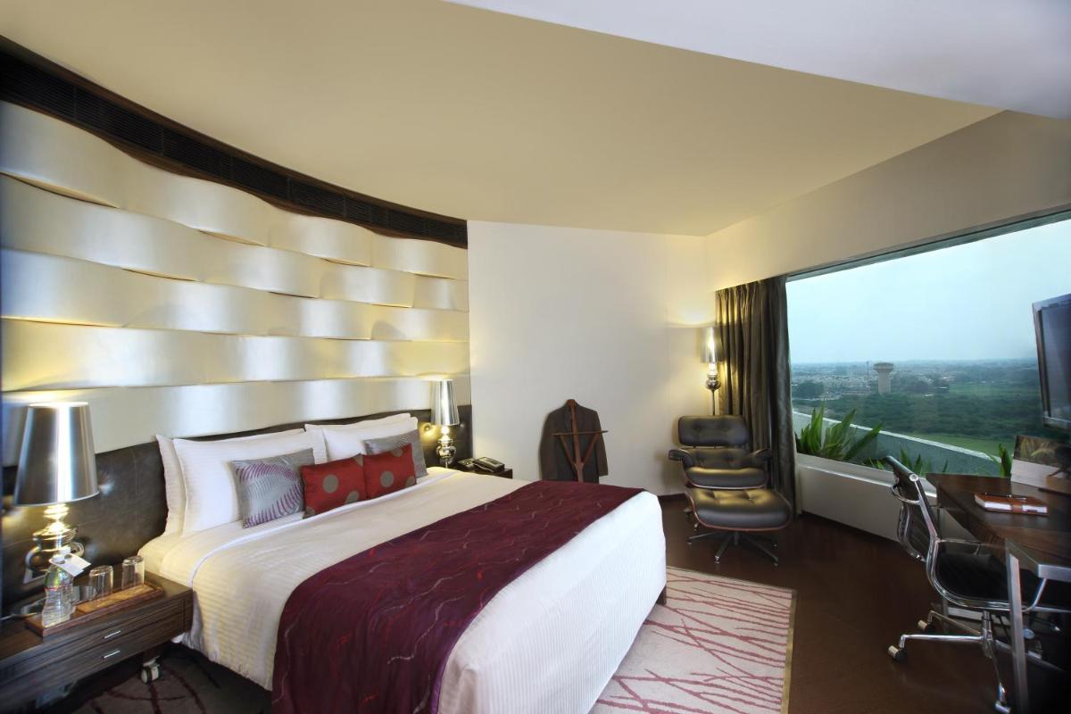 a hotel room with a large bed and a large window at Fortune Select SG Highway, Ahmedabad - Member ITC Hotels' Group in Ahmedabad