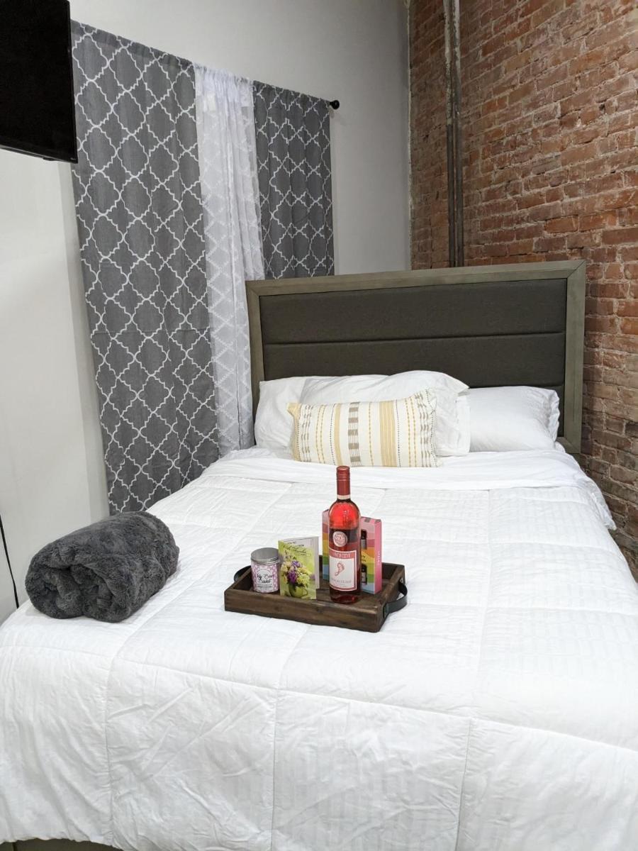 Idiosyncratic_ Brick wall style, studio apartment. - Housity