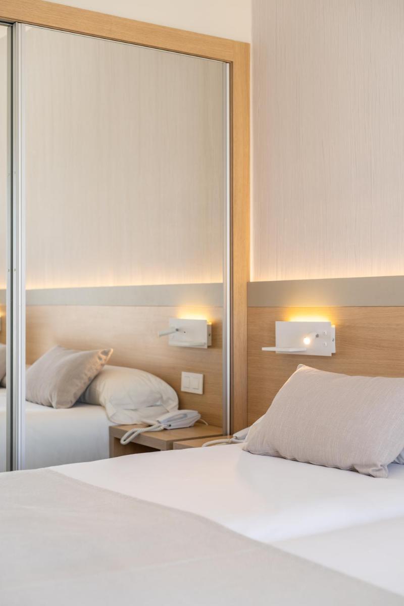 Cama o camas de una habitación en Hotel Samos