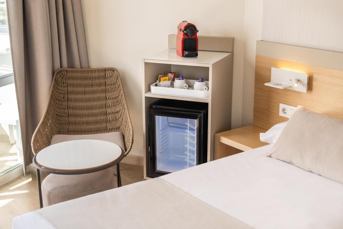 Cama o camas de una habitación en Hotel Samos