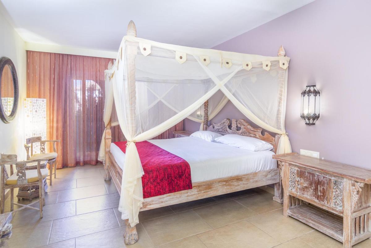 Cama o camas de una habitación en El Cortijo de Zahara by QHotels