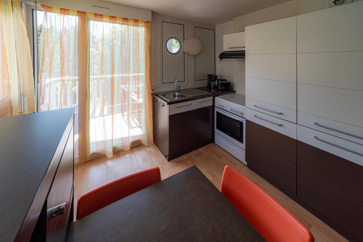 Cuisine ou kitchenette dans l'établissement Residence RADIANA