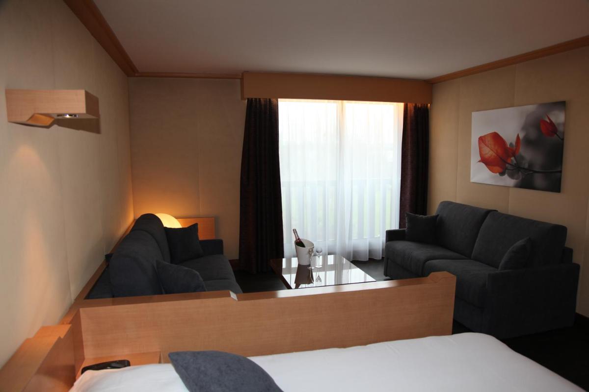 Un ou plusieurs lits dans un hébergement de l'établissement Amirauté Hôtel Golf Deauville