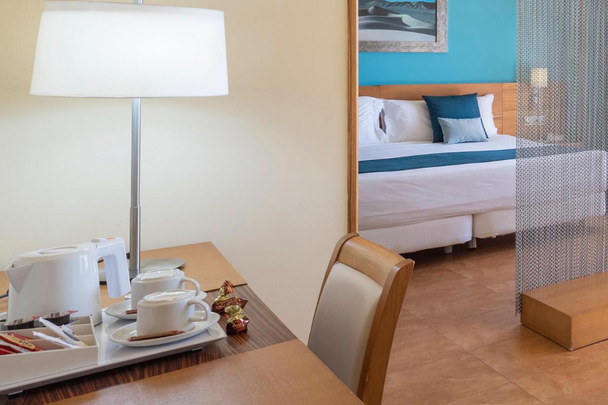 Cama o camas de una habitación en Elba Carlota Beach & Golf Resort