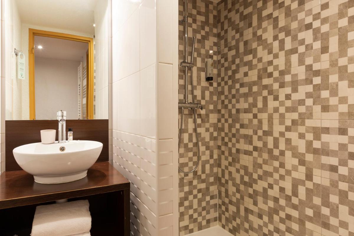 Salle de bains dans l'établissement SOWELL HOTELS Mont Blanc et SPA