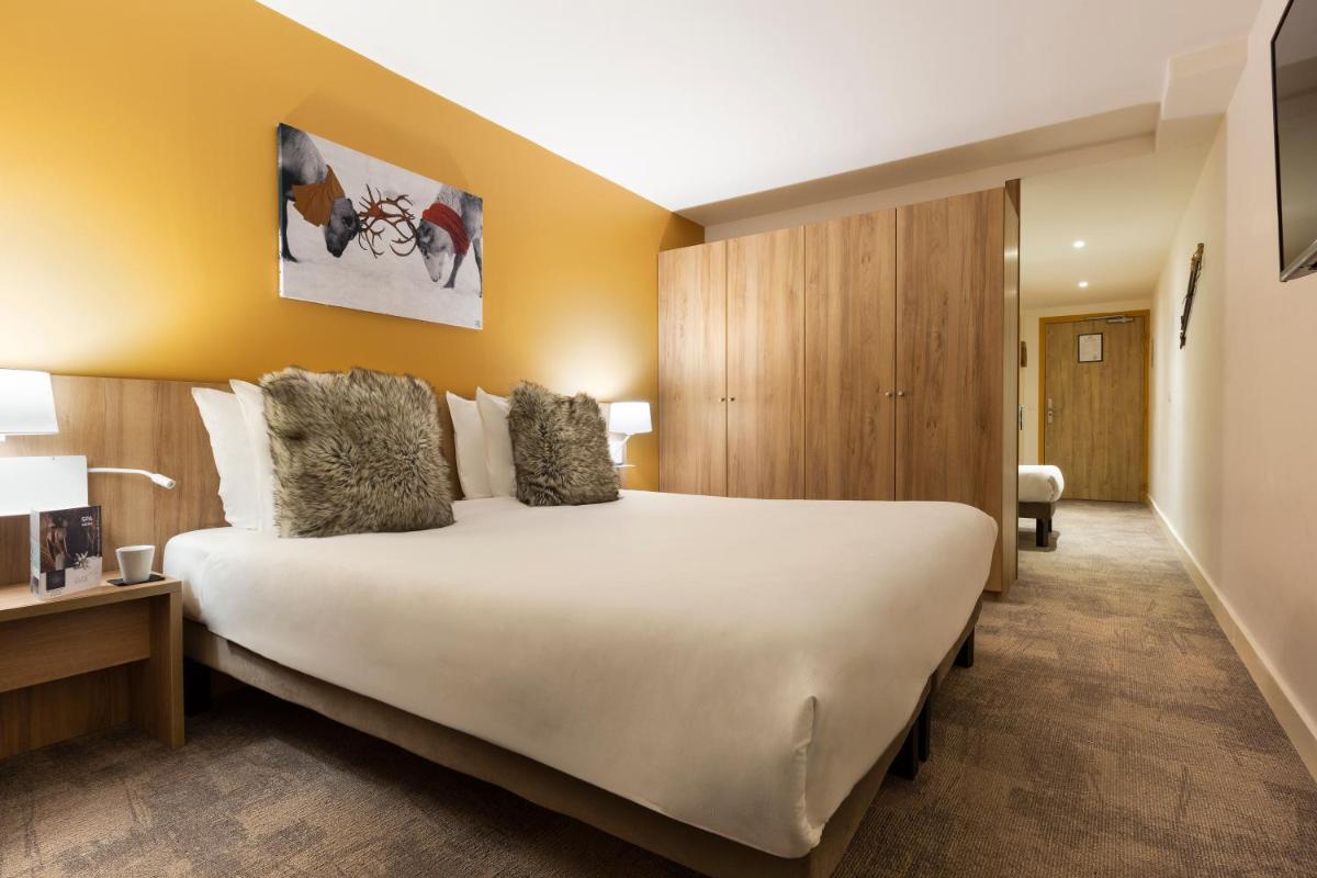 Un ou plusieurs lits dans un hébergement de l'établissement SOWELL HOTELS Mont Blanc et SPA