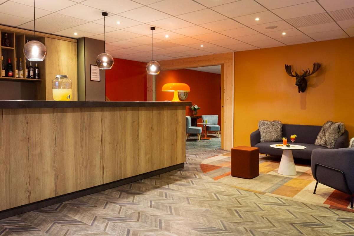 Coin salon dans l'établissement SOWELL HOTELS Mont Blanc et SPA