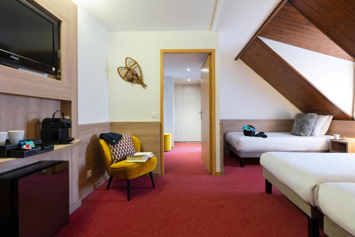 Un ou plusieurs lits dans un hébergement de l'établissement SOWELL HOTELS Mont Blanc et SPA
