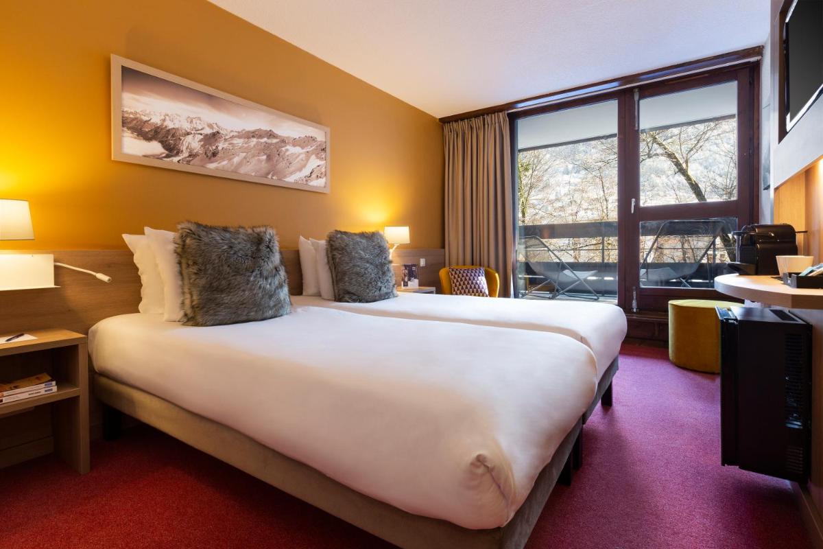 Un ou plusieurs lits dans un hébergement de l'établissement SOWELL HOTELS Mont Blanc et SPA