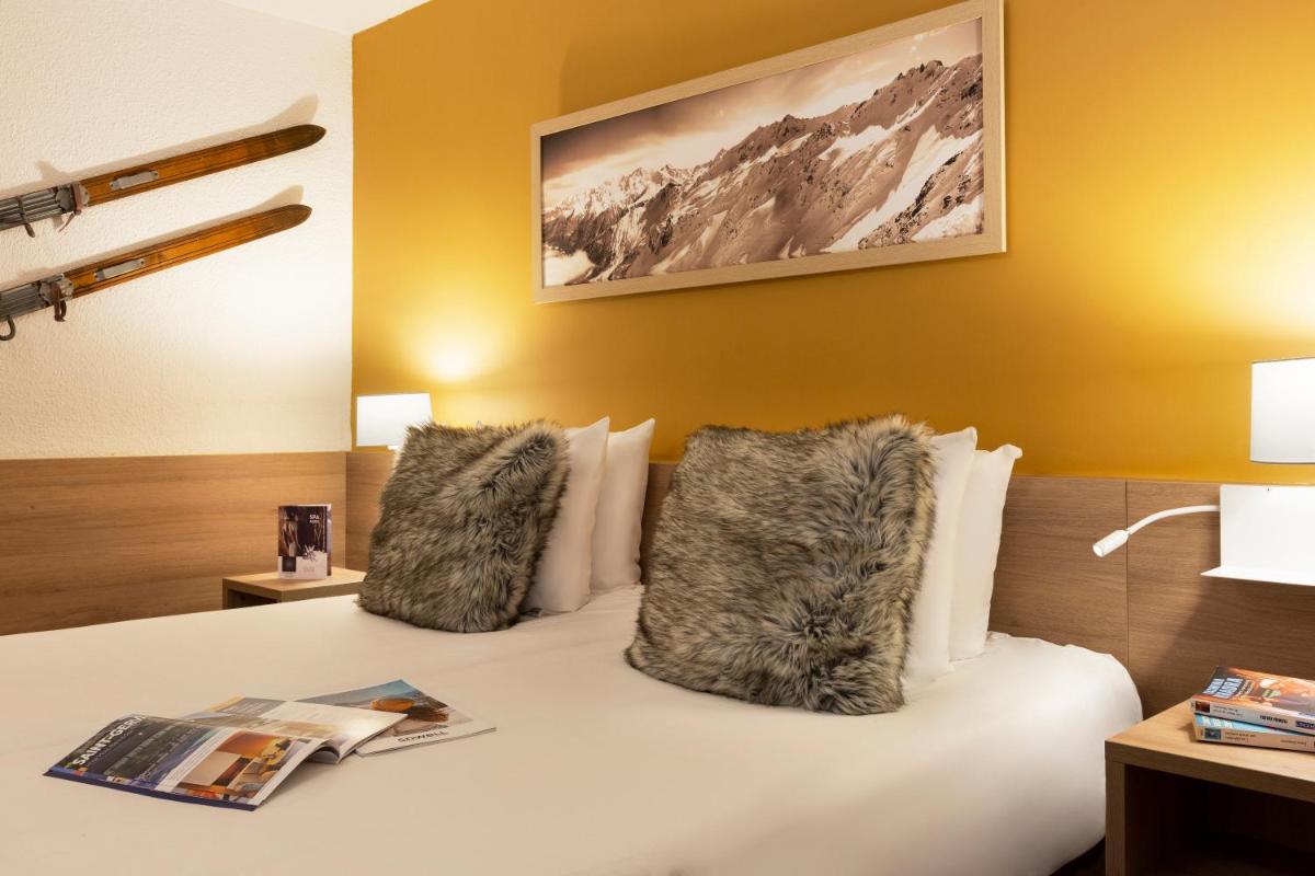Un ou plusieurs lits dans un hébergement de l'établissement SOWELL HOTELS Mont Blanc et SPA