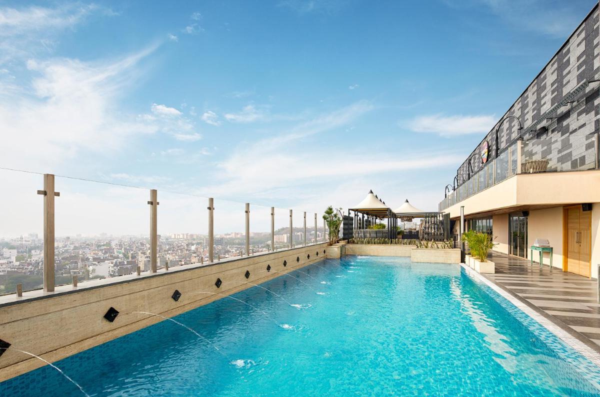 a swimming pool on the roof of a building at Hyatt Place Jaipur Malviya Nagar in Jaipur a swimming pool on the roof of a building at Hyatt Place Jaipur Malviya Nagar in Jaipur