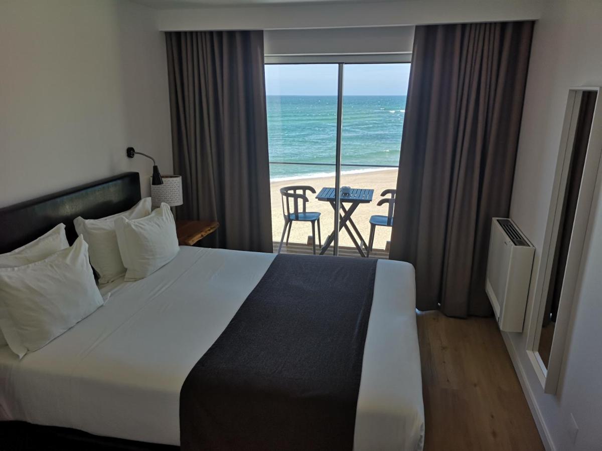 Uma cama ou camas num quarto em Promar - Eco Beach & Spa Hotel