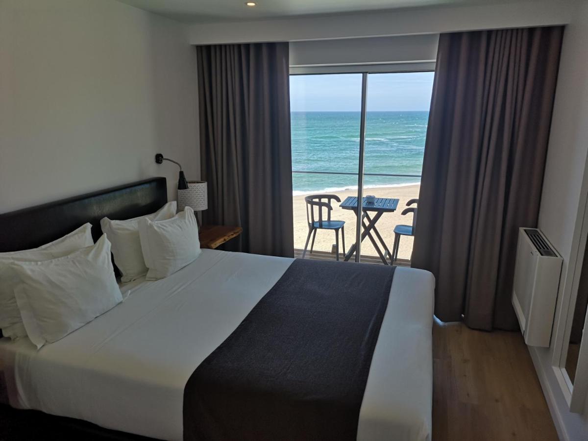 Uma cama ou camas num quarto em Promar - Eco Beach & Spa Hotel