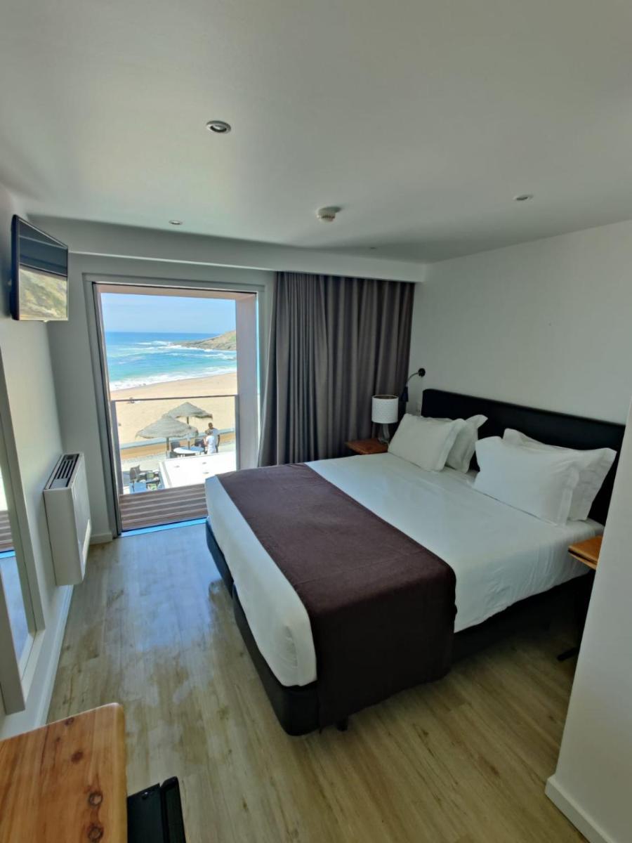 Uma cama ou camas num quarto em Promar - Eco Beach & Spa Hotel