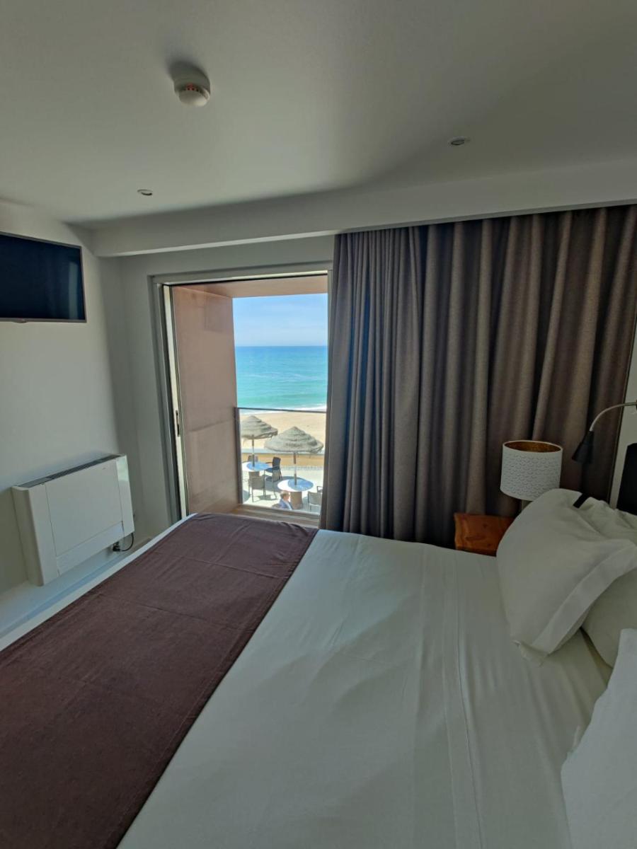 Uma cama ou camas num quarto em Promar - Eco Beach & Spa Hotel