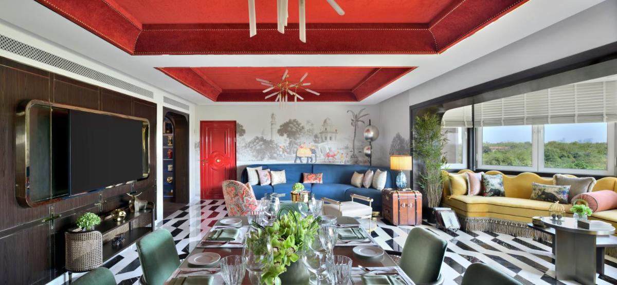 a living room with a couch and a tv at Taj Mahal, New Delhi in New Delhi