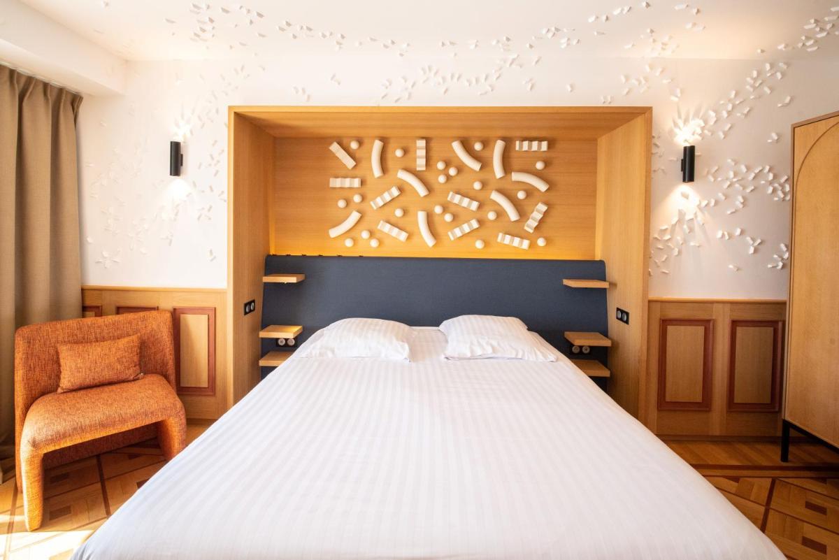 Un ou plusieurs lits dans un hébergement de l'établissement Splendid Hotel & Spa Nice