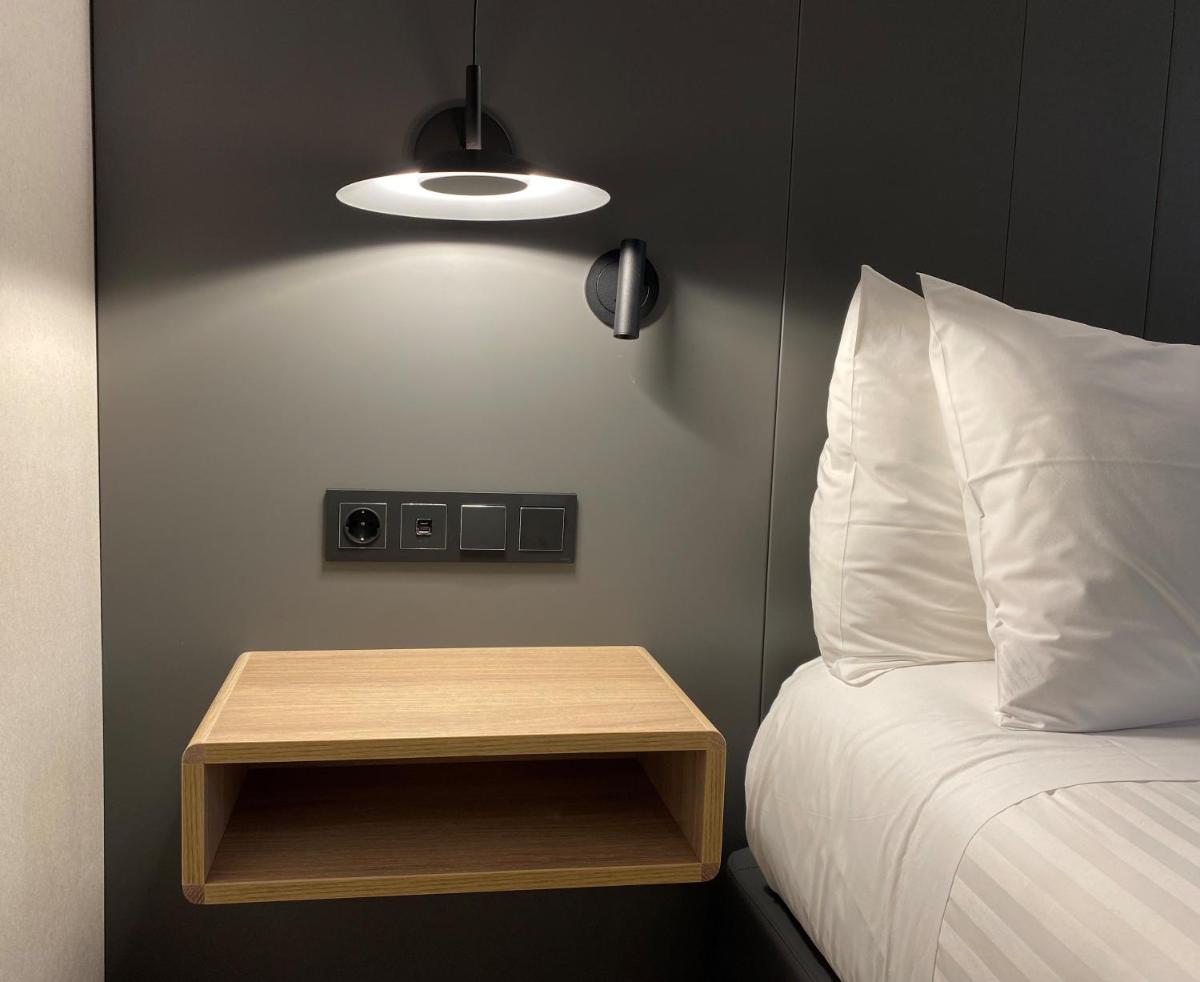 Cama o camas de una habitación en Silken Ciudad Gijón