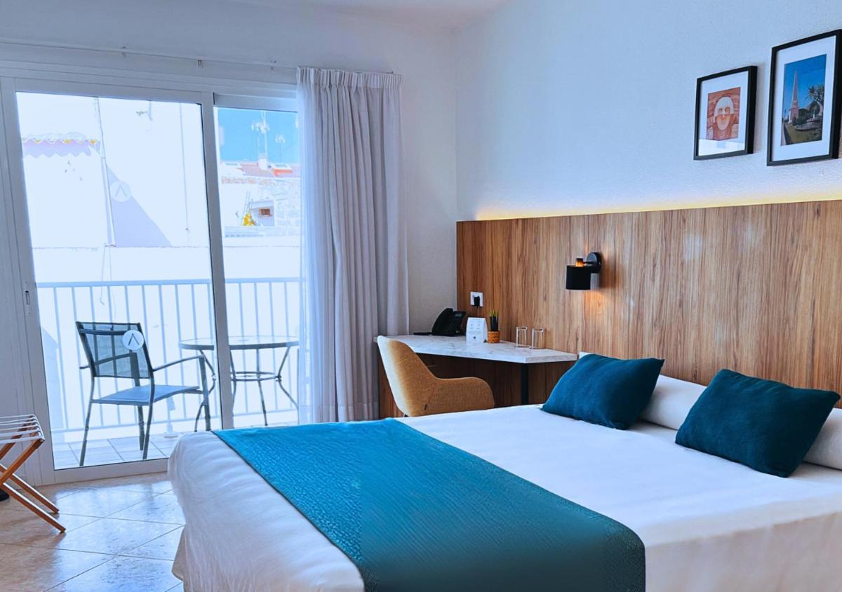 Cama o camas de una habitación en Alfons Hotel