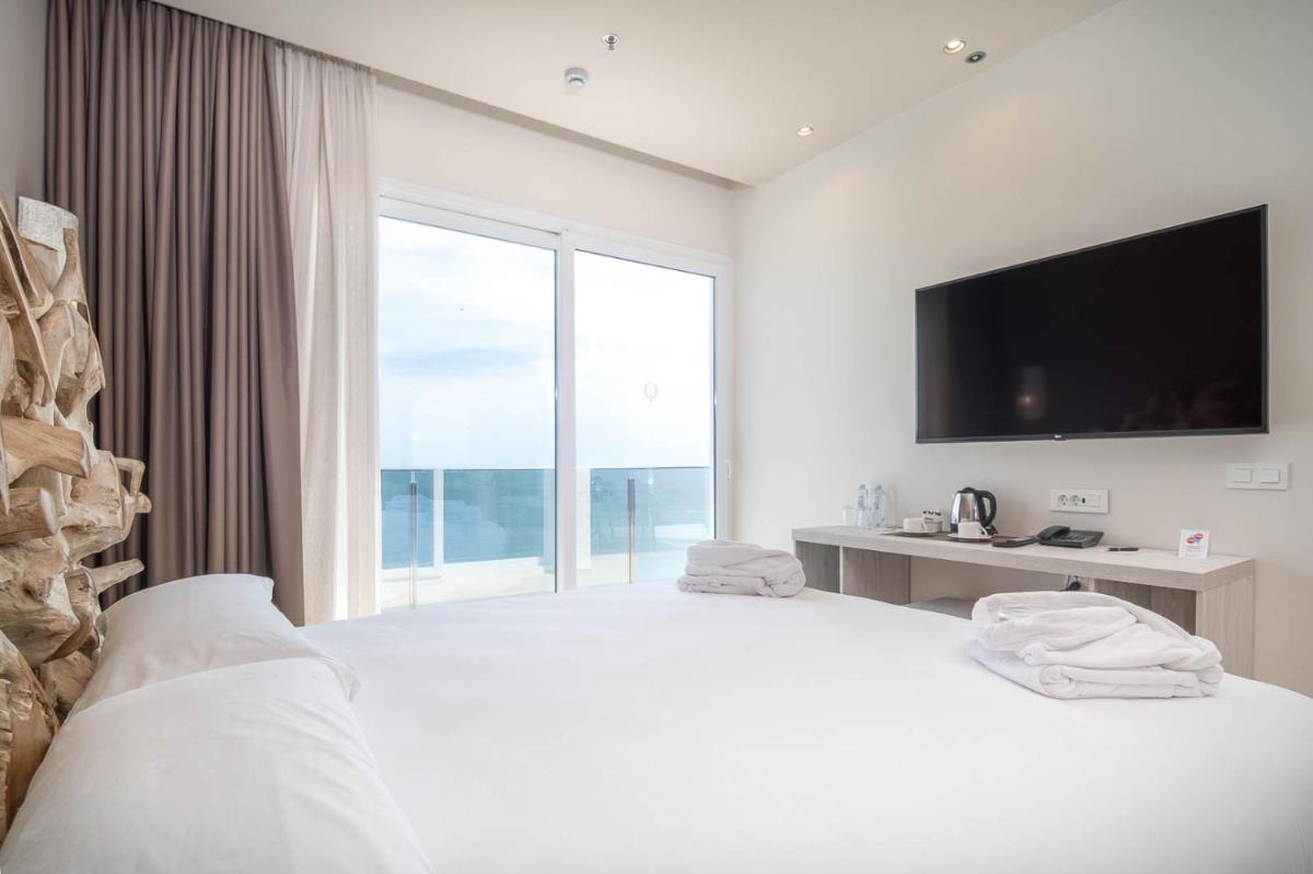Cama o camas de una habitación en Cádiz Bahía by QHotels