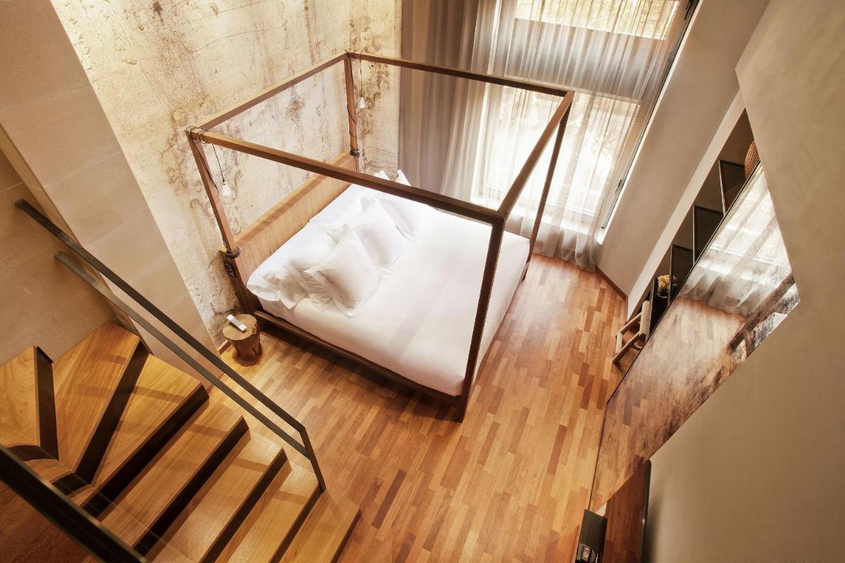 Cama o camas de una habitación en Claris Hotel & Spa GL, a Small Luxury Hotel of the World