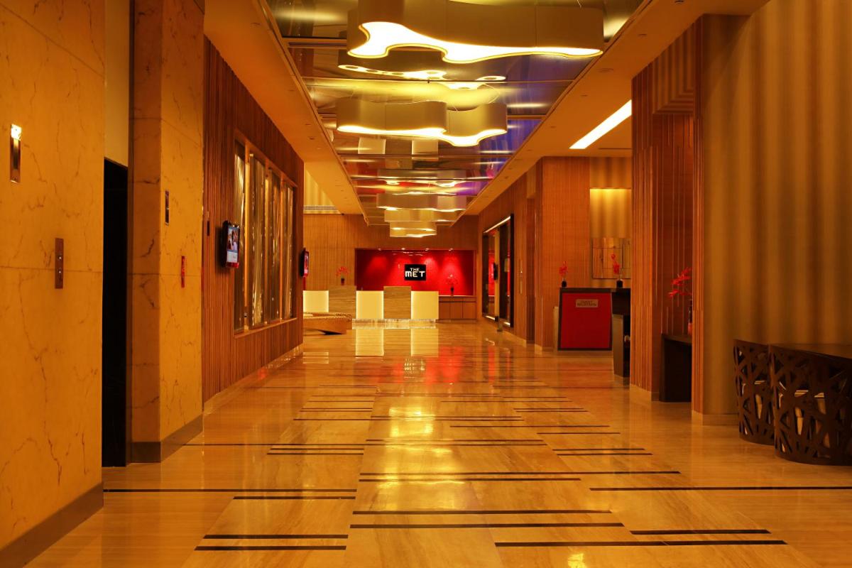 an empty hallway of a building with a long hallwayngth at The Metropolitan Hotel & Spa New Delhi in New Delhi