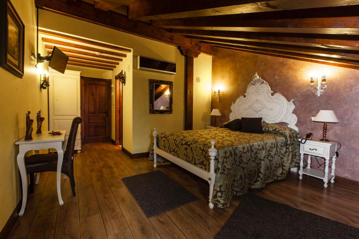 Cama o camas de una habitación en Hotel Spa Casona La Hondonada